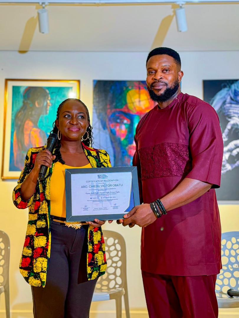 Victor receiving a certificate of recognition at an industry event