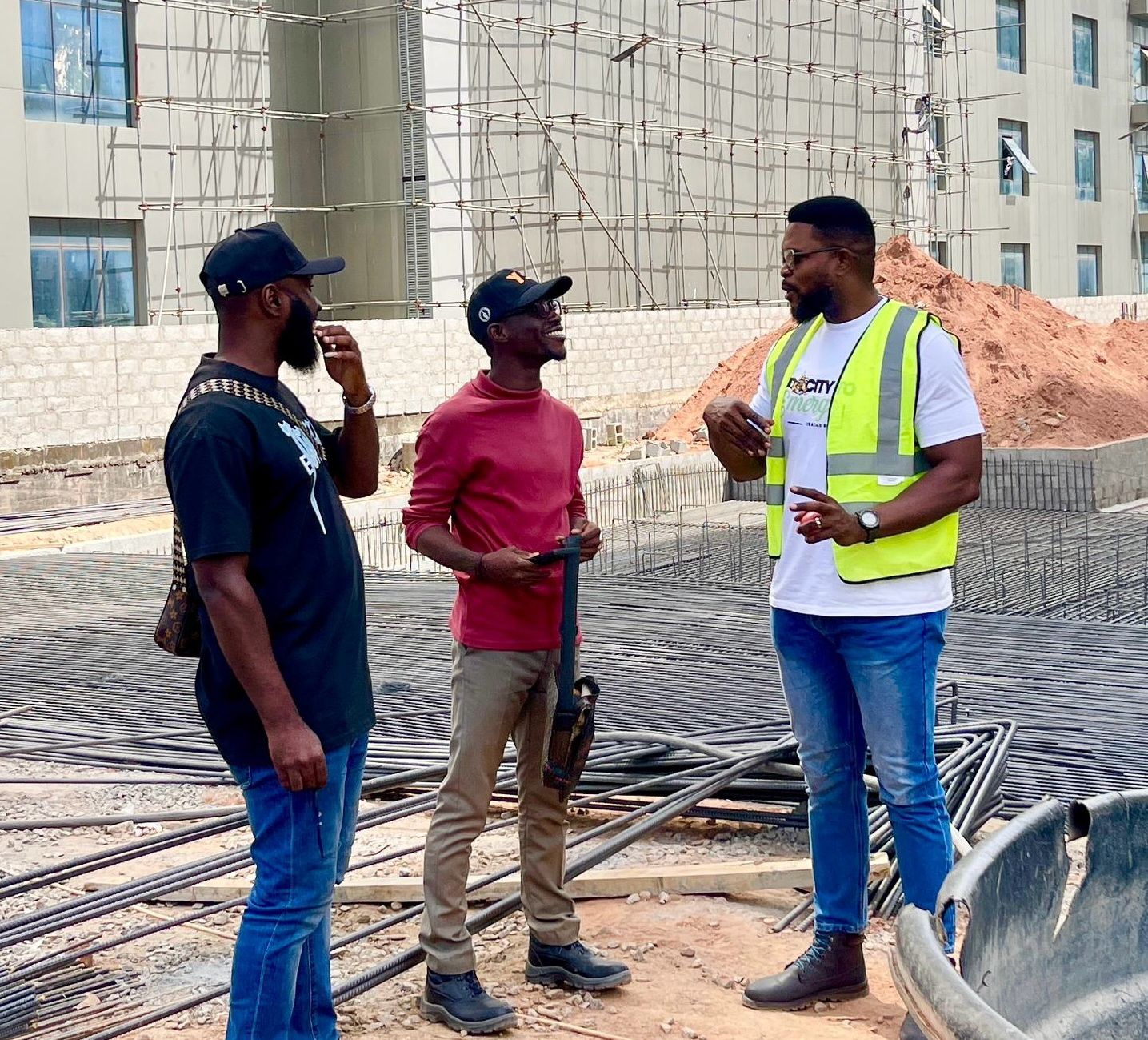 Victor leading a project discussion with colleagues on an active construction site