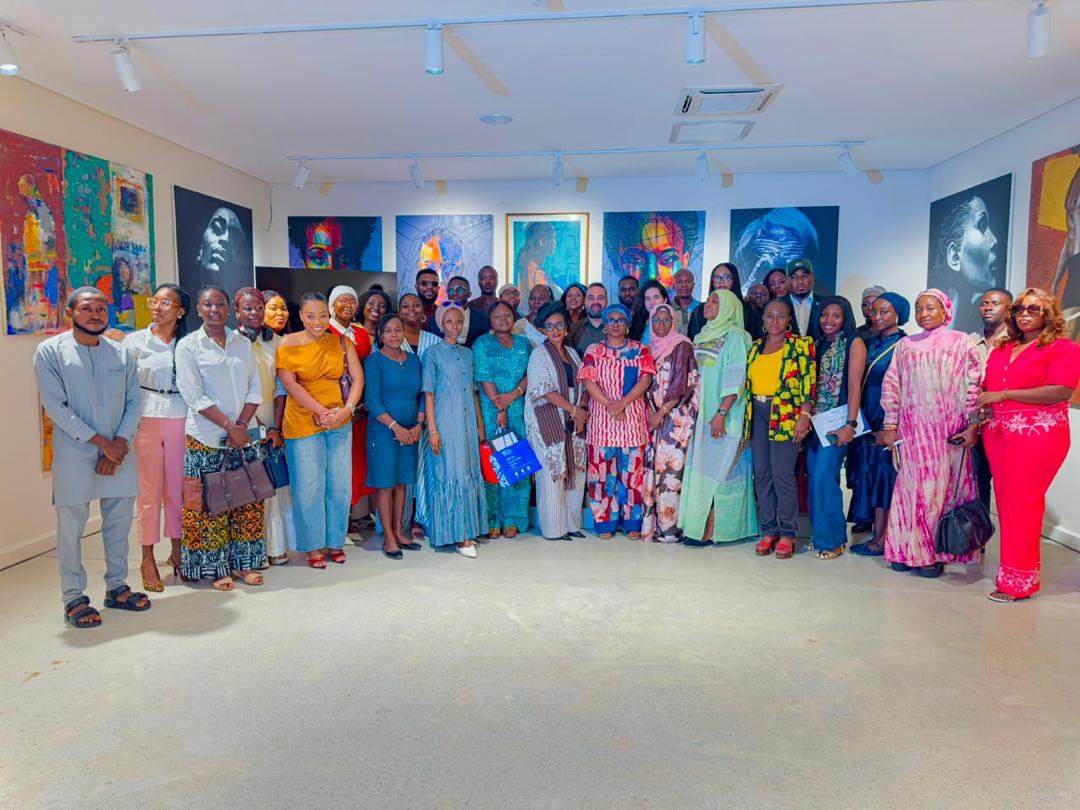 Group photograph of speakers and attendees after an event